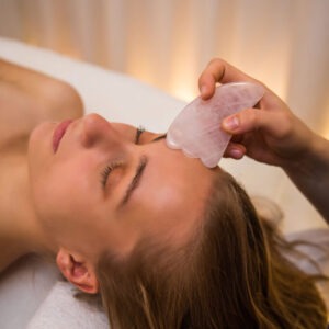 Woman relaxing during a facial treatment